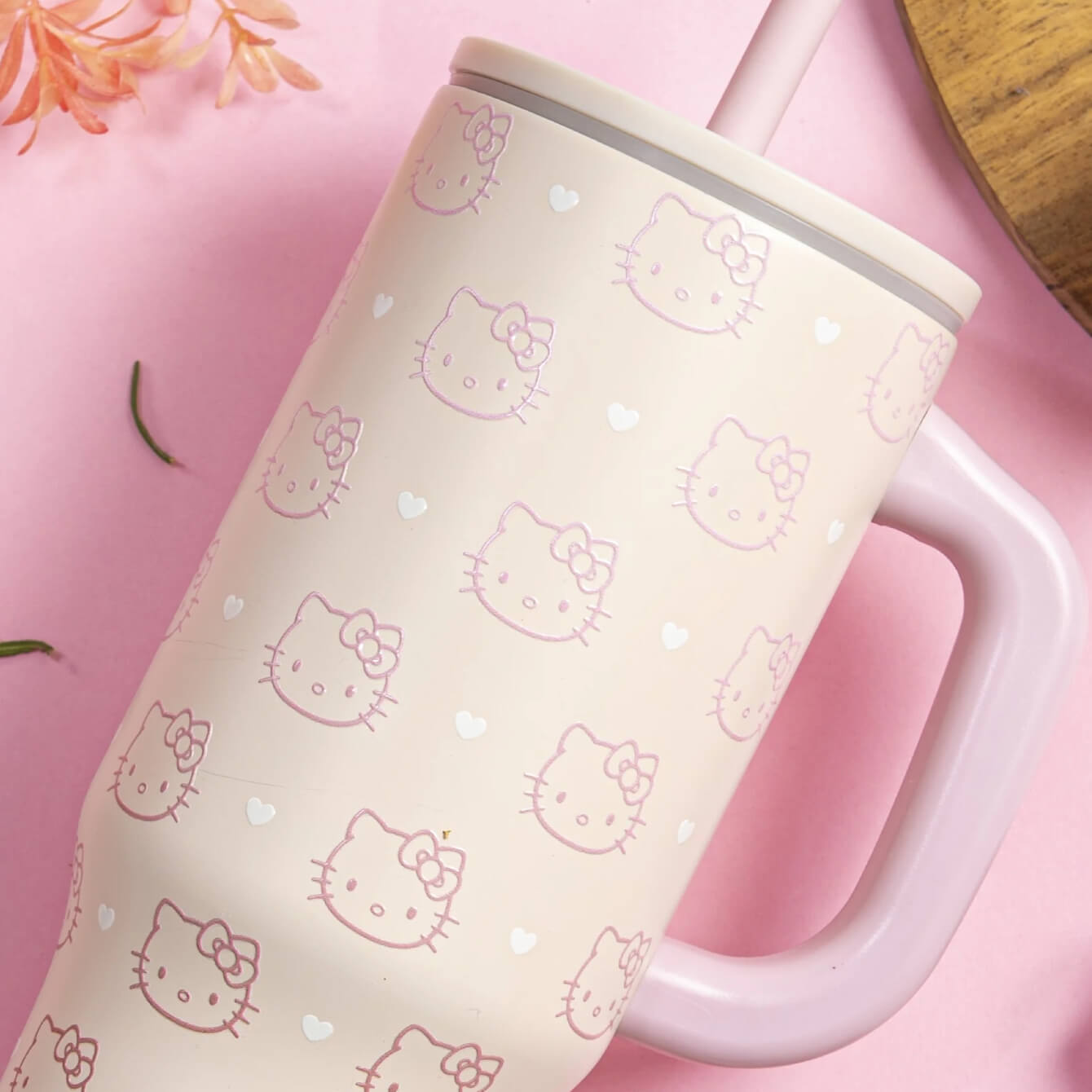 close up of pink hello kitty tumbler with handle