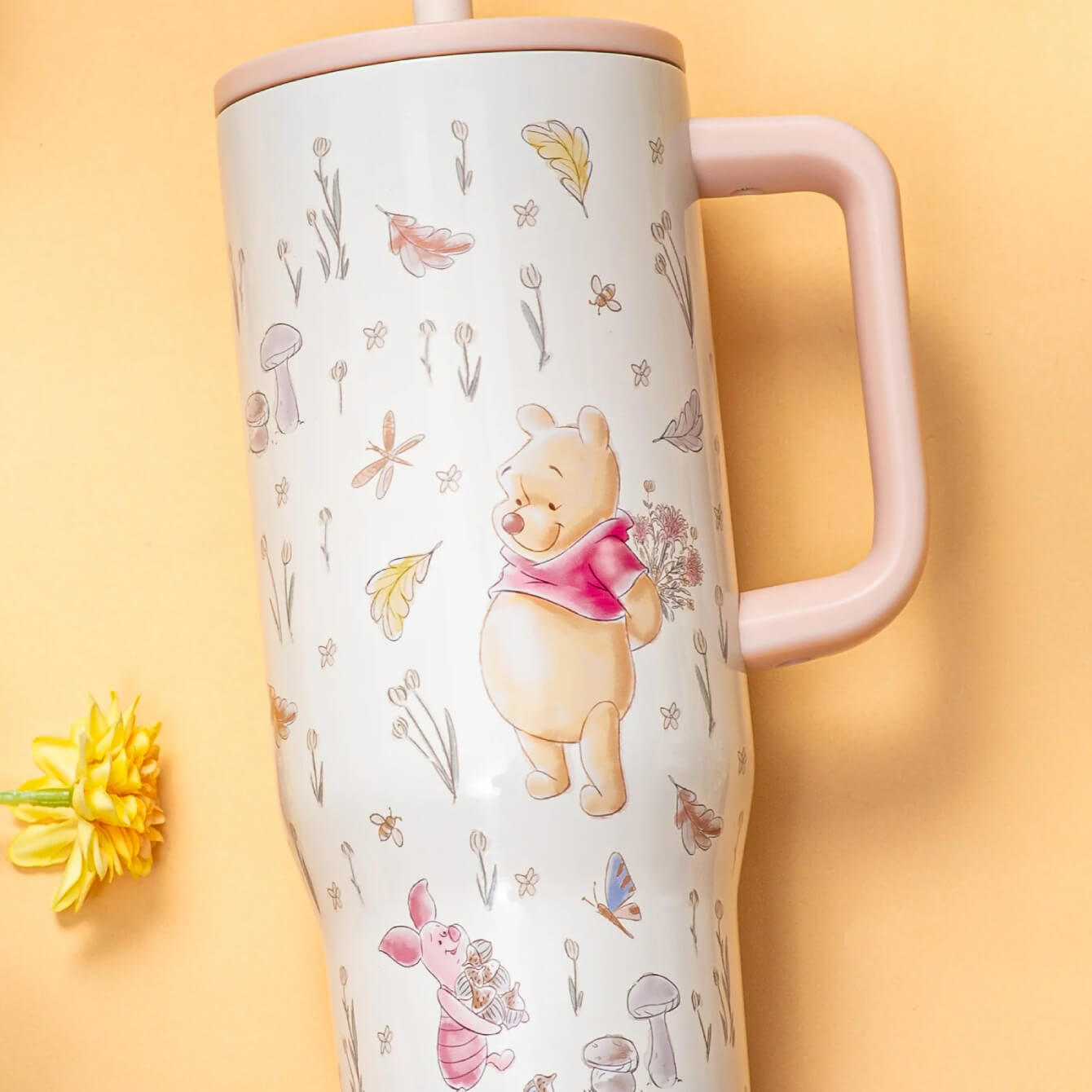 close up of large tumbler with floral winnie the pooh artwork