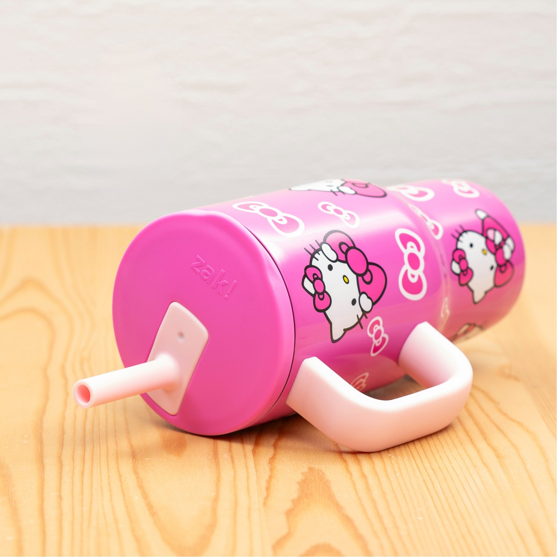 Kids Hello Kitty straw tumbler spill free laying on side