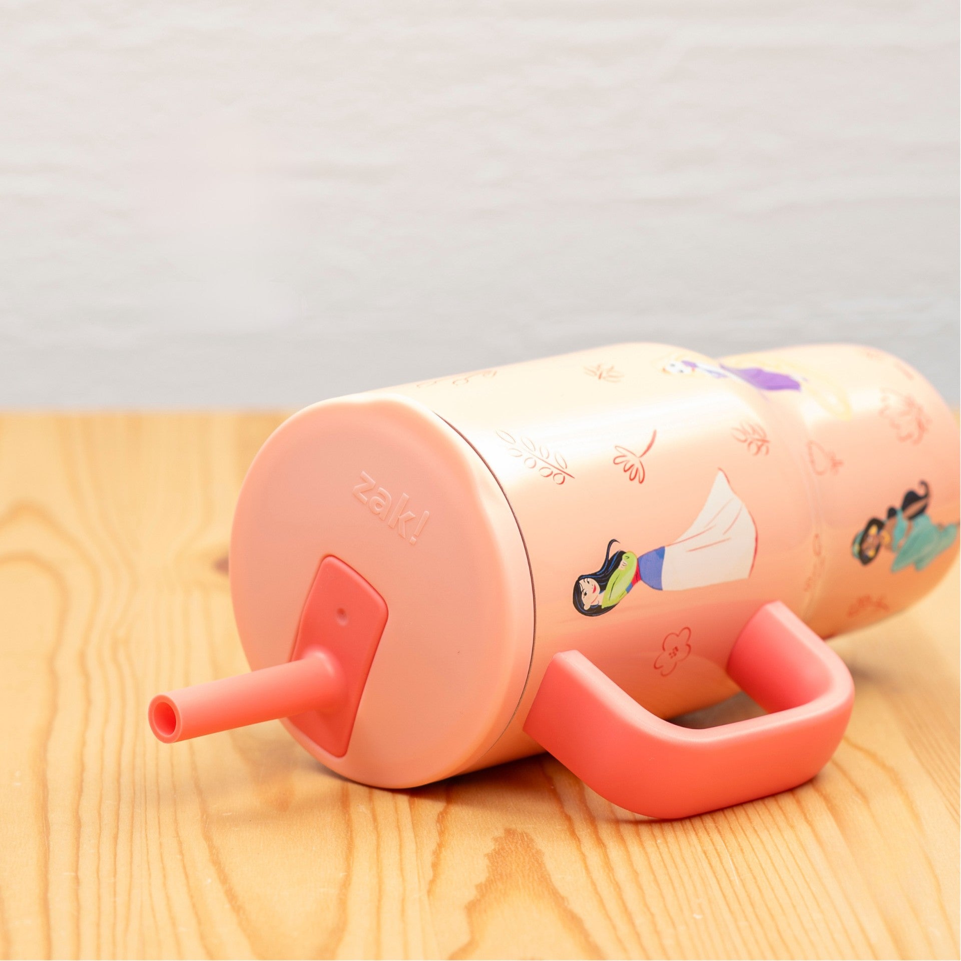 Kids princess tumbler laying on light wood tabletop