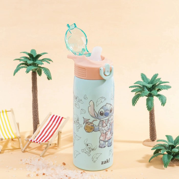 Colorful water bottle with cartoon character design on a sandy background with palm trees and a chair.