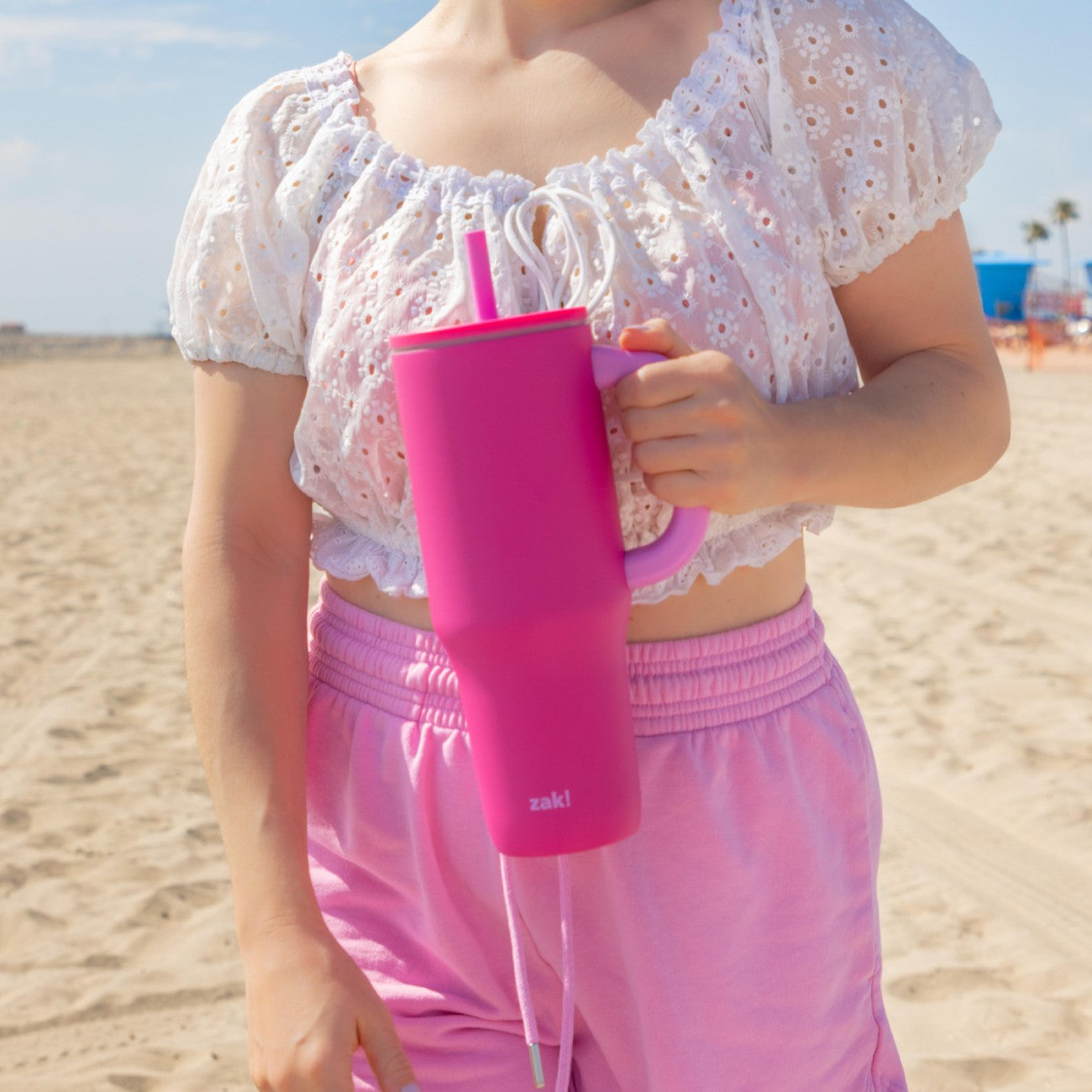 Bright pink 40 ounce straw tumbler with handle