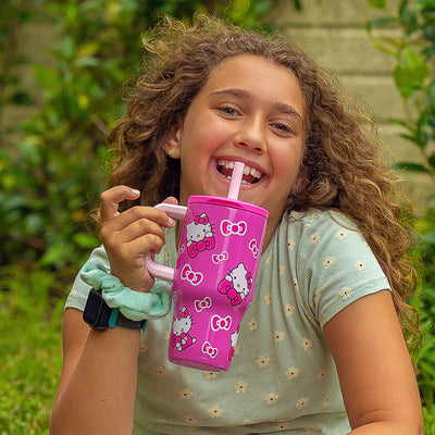 Child holding Fairway Kids Insulated Straw Tumbler - Hello Kitty, 16 ounces